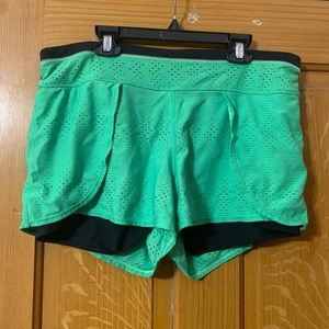 Green athleta running shorts